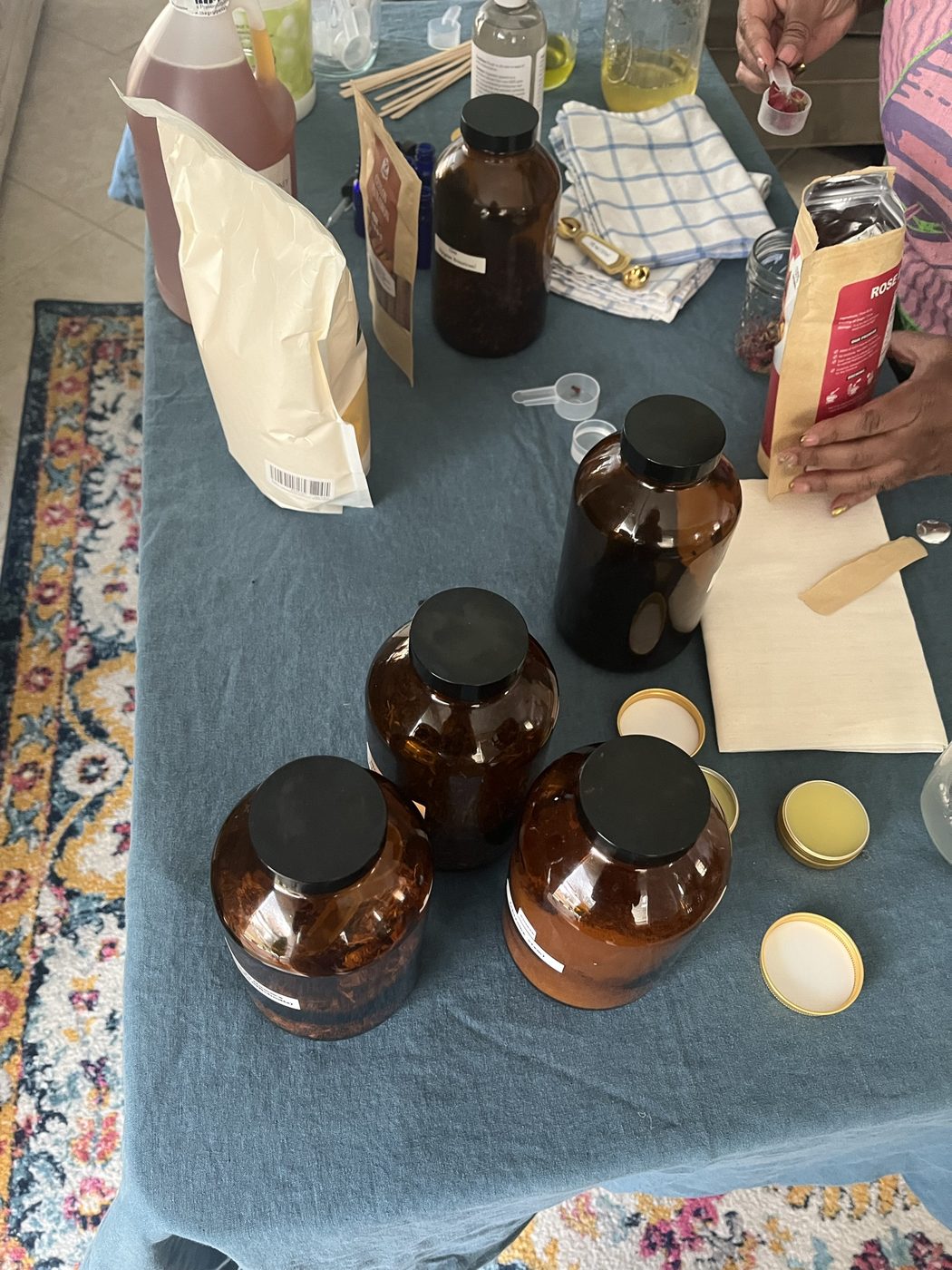 Three amber apothecary jars with infusion materials