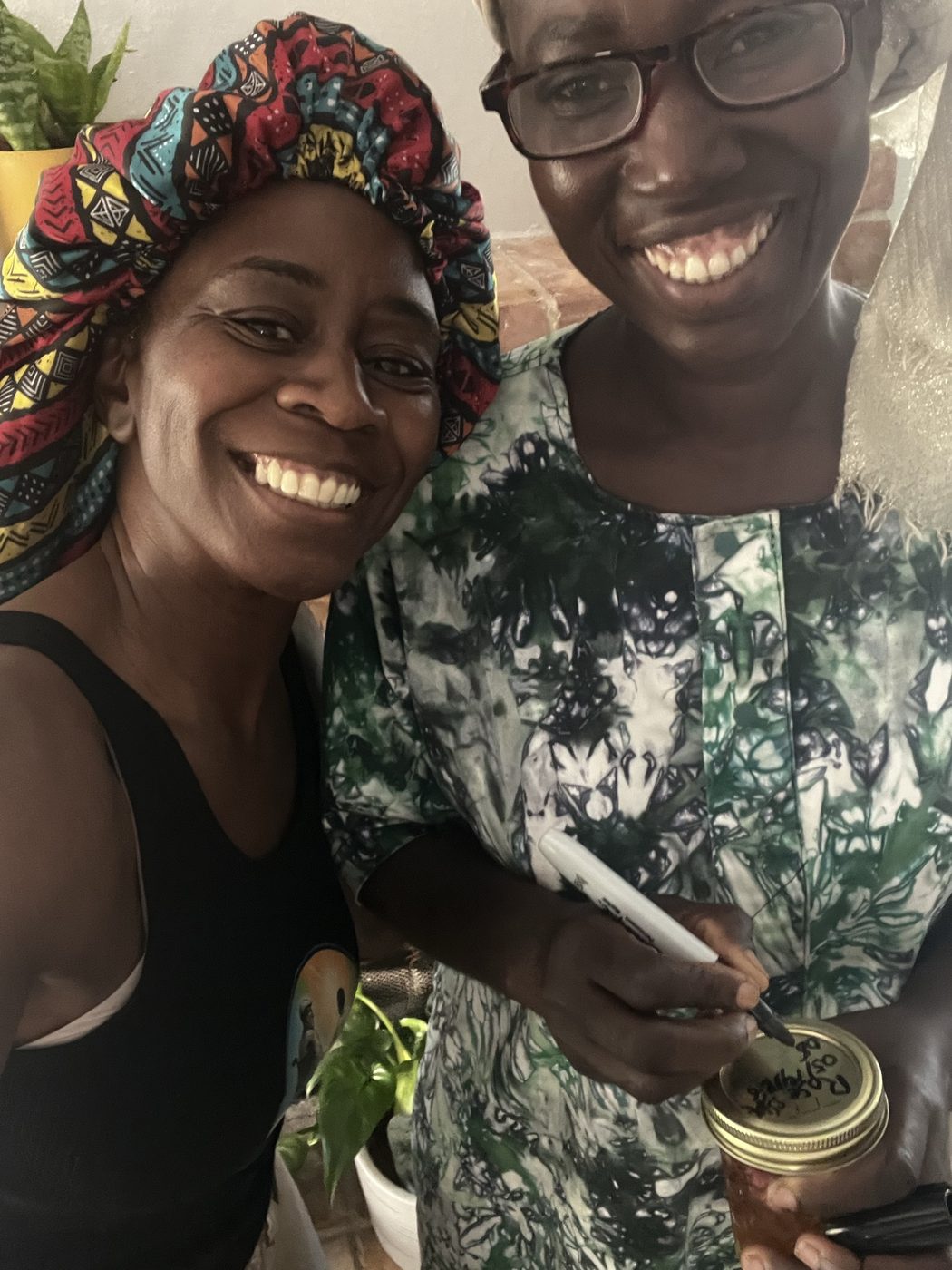JC and Francisca signing a solar infusion jar
