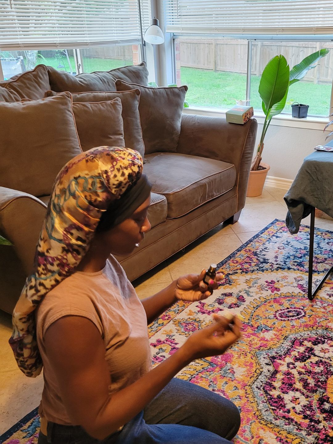 Workroom light over jars of infused oil and herbs